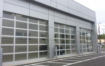 Commercial building with large glass-panel overhead doors